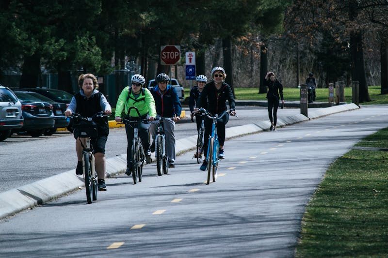 Where are Pak Edo and his family's favorite places for cycling